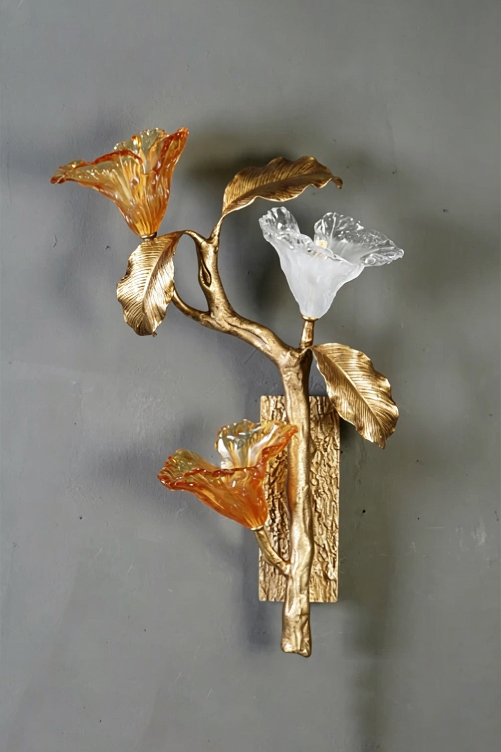 Arboreal Bloom Brass Wall Lamp | Brass, Glass | Frontal view of the unlit lamp against a grey textured wall | Isolated shot | vexa lamps