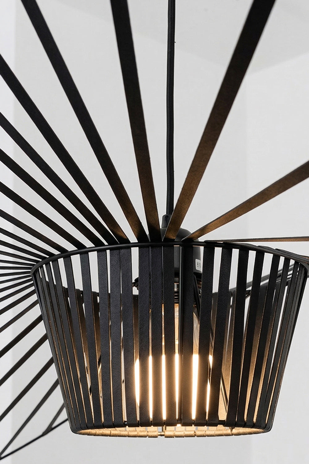 Macro shot of black pendant lamp ribs | Metal | Polyurethane elastic cloth | Glass fiber | Focusing on the fine material texture and design | vexa lamps