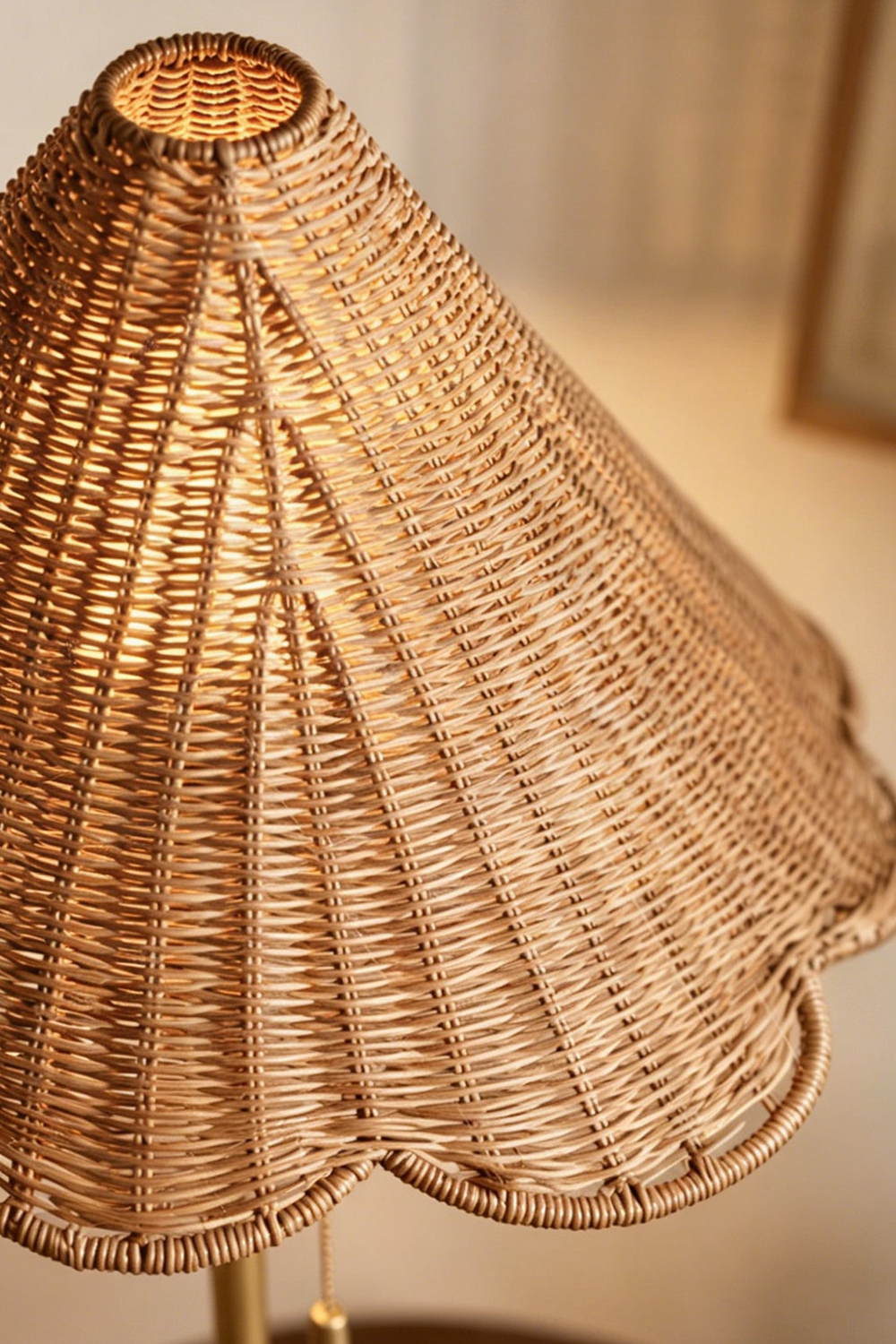 Osrilla Scalloped Rattan Table Lamp | Rattan, Brass | Macro close-up top-angled shot highlighting the intricate wavy scalloped edge and natural texture of the woven rattan conical lampshade | Detail shot | vexa lamps
