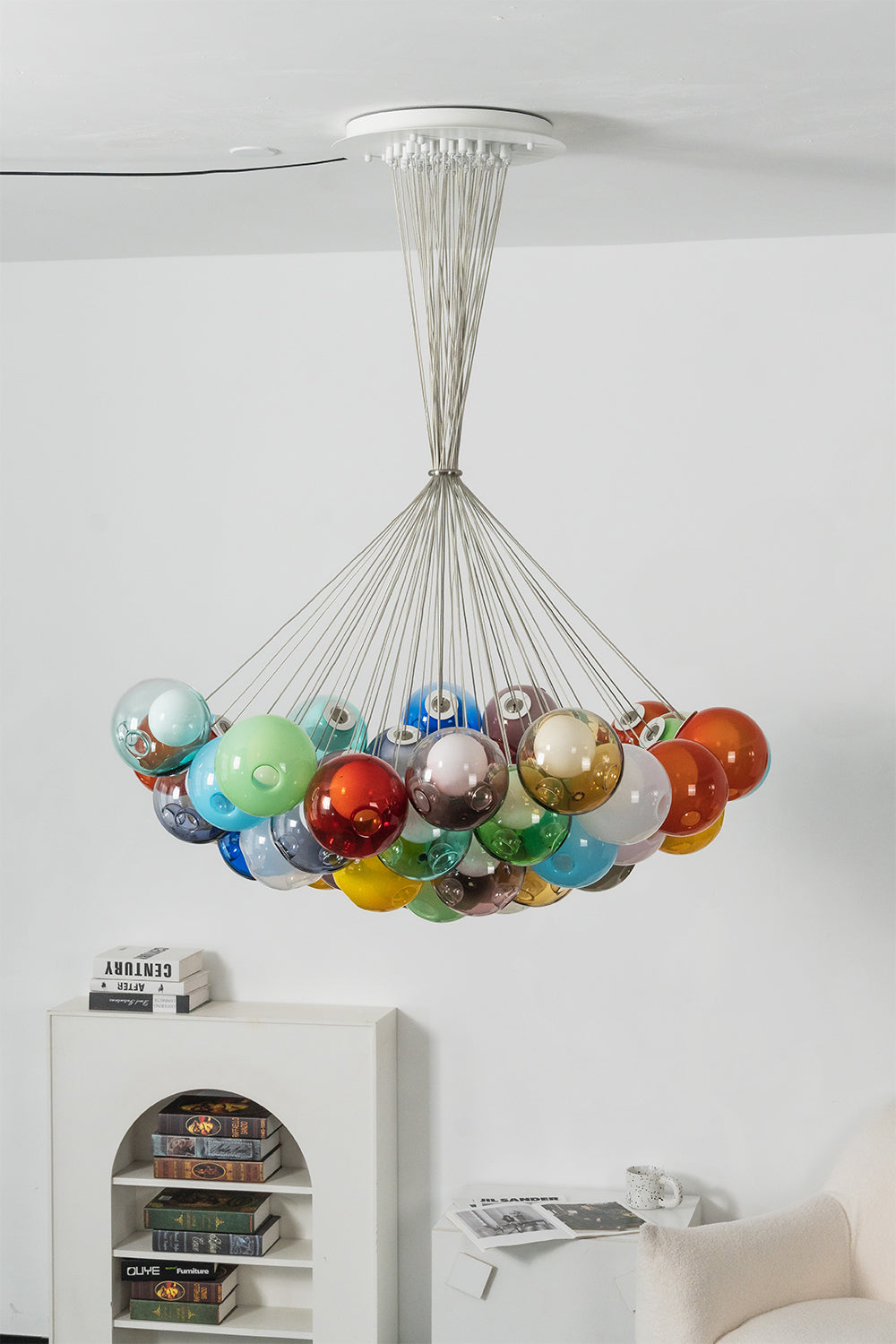 Rainbow Glass Bubble Cluster Chandelier | Glass, Metal | Complete frontal view of the colorful cluster fixture suspended elegantly over a minimalist white sideboard console | vexa lamps