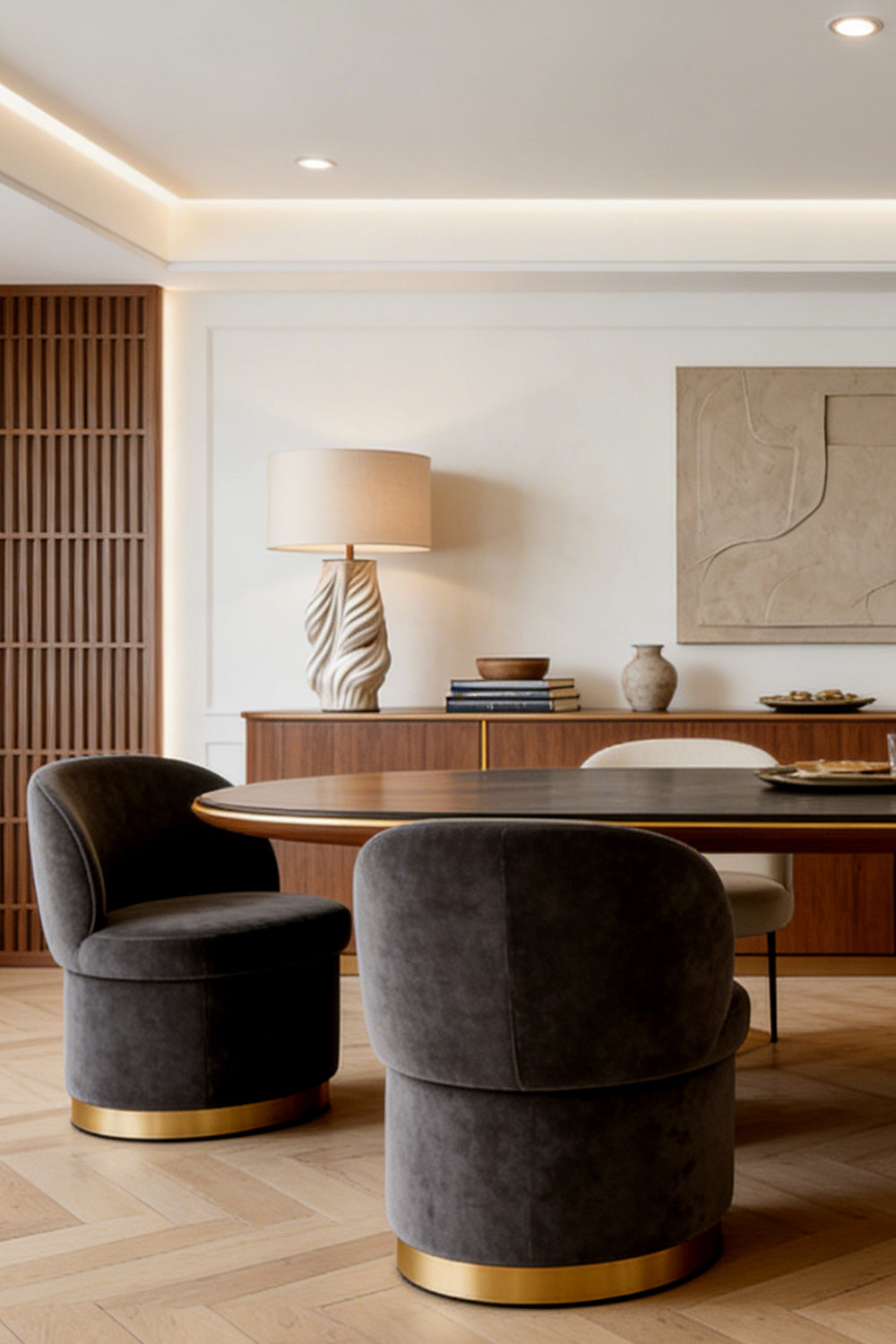 Adara Sculptural Ceramic Table Lamp | Ceramic, Fabric | Staged elegantly on a long wooden credenza sideboard in a refined open-plan dining and living space with dark accents | vexa lamps
