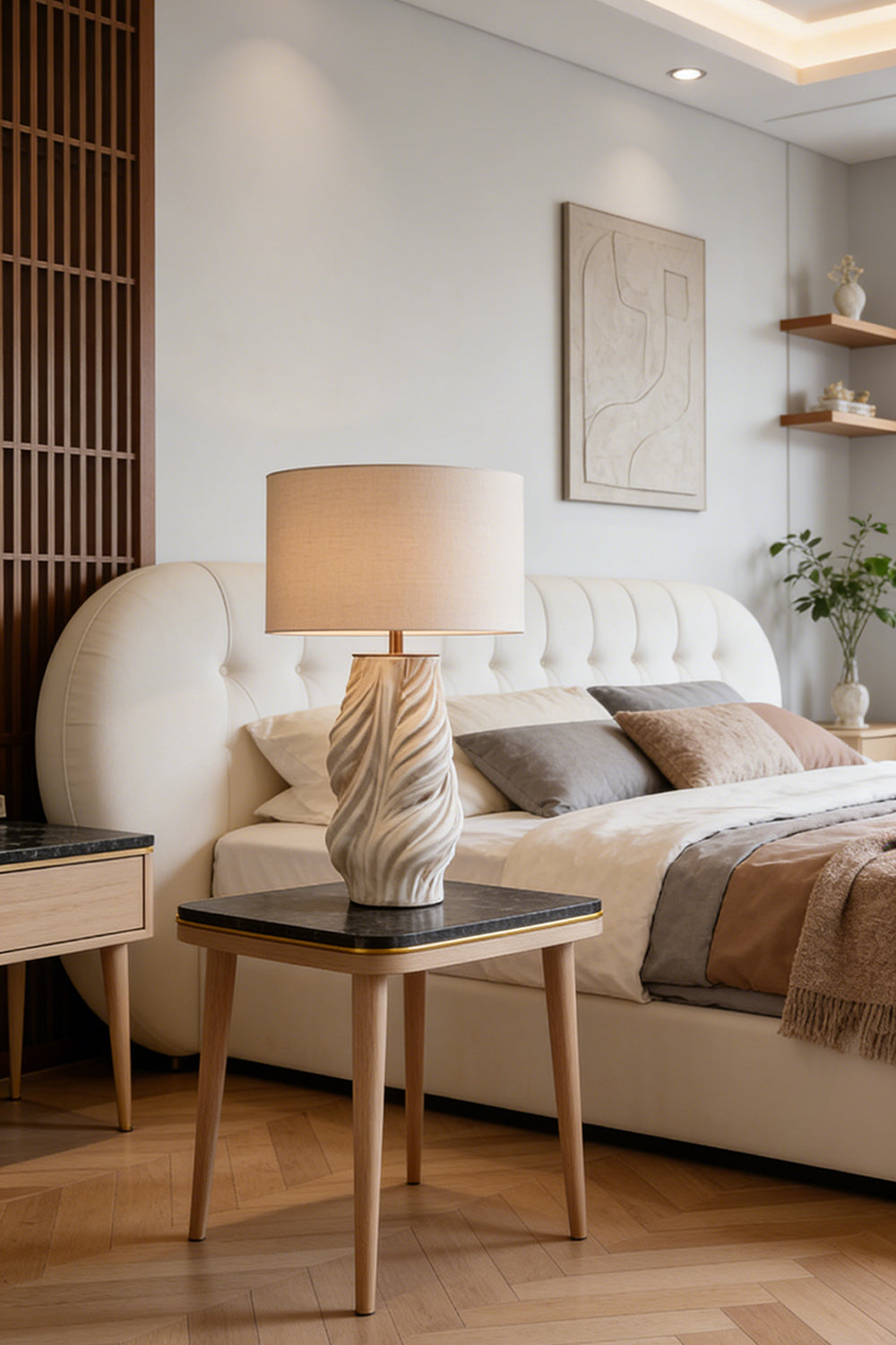 Adara Sculptural Ceramic Table Lamp | Ceramic, Fabric | Serving as a cozy bedside lamp on a wood nightstand next to a contemporary platform bed with neutral linens | vexa lamps