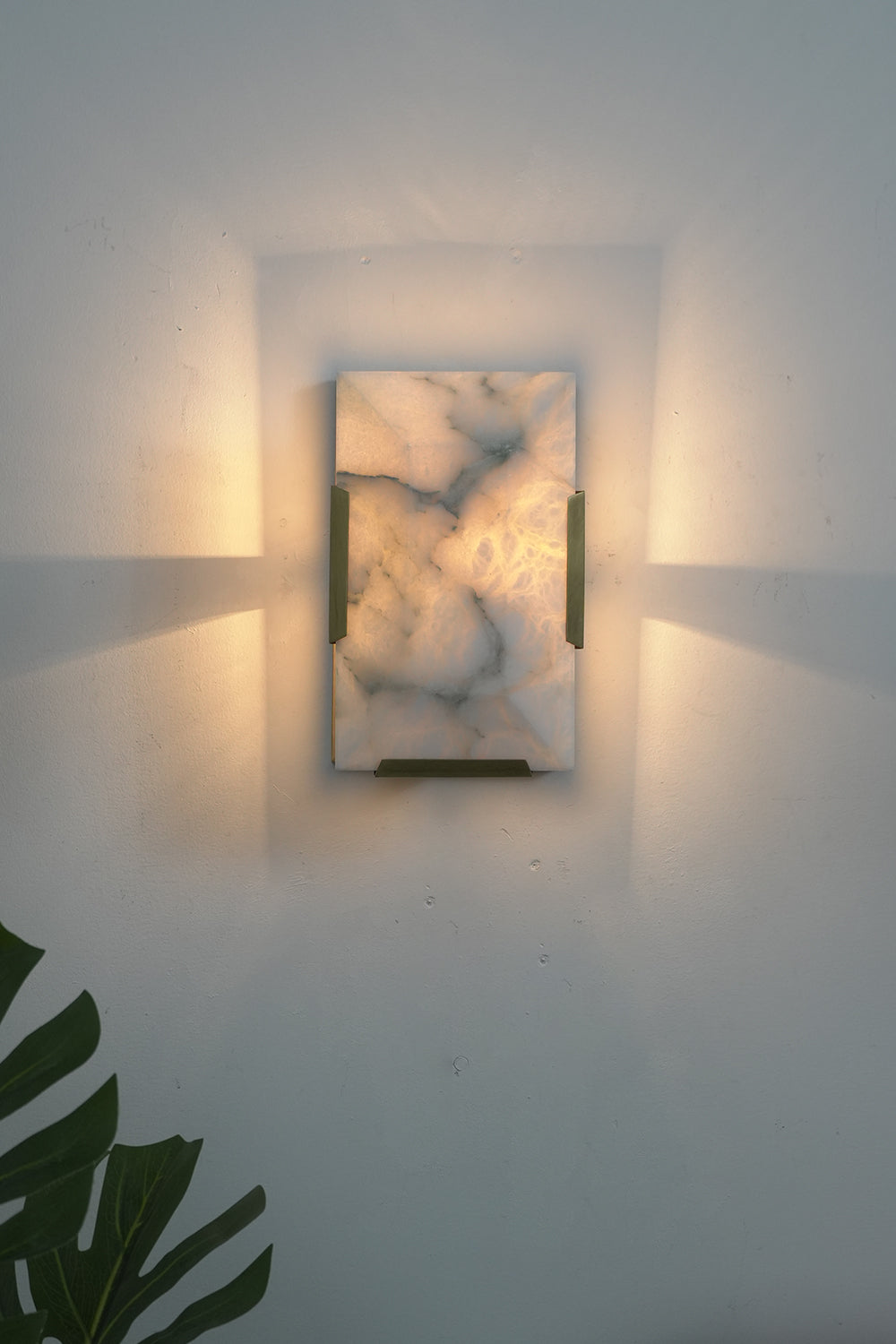 Lit 1-panel rectangular alabaster wall lamp with brass accents | Brass, Alabaster | Front view isolated on white background | vexa lamps