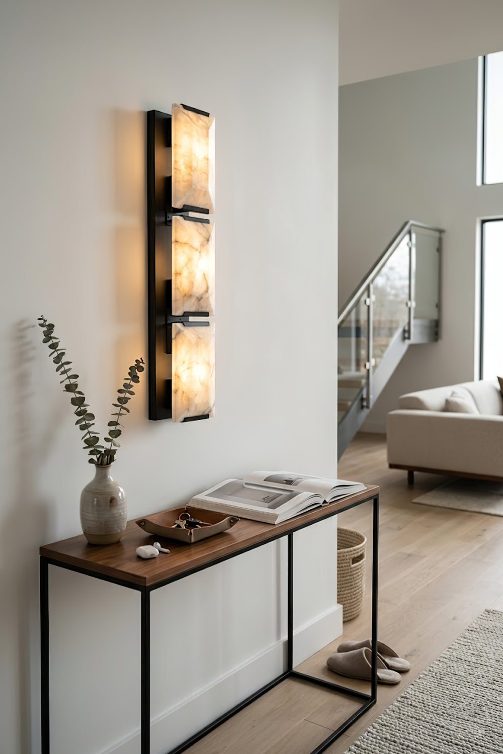 Vertical rectangular alabaster sconce | Brass, Alabaster | Installed in a modern hallway over a console table | vexa lamps