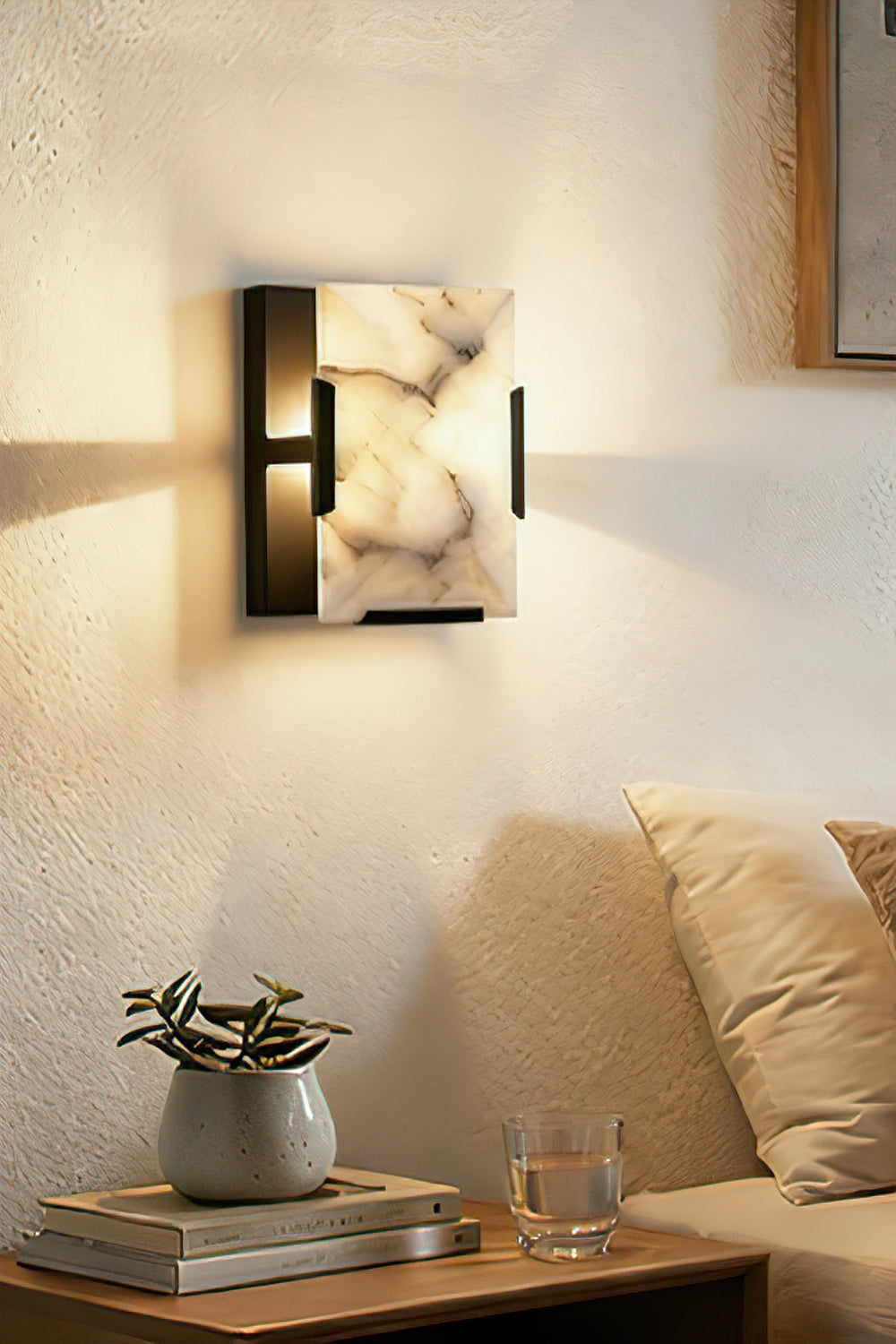 Square alabaster wall sconce with brass bracket | Brass, Alabaster | Installed above a side table in a lounge area | vexa lamps