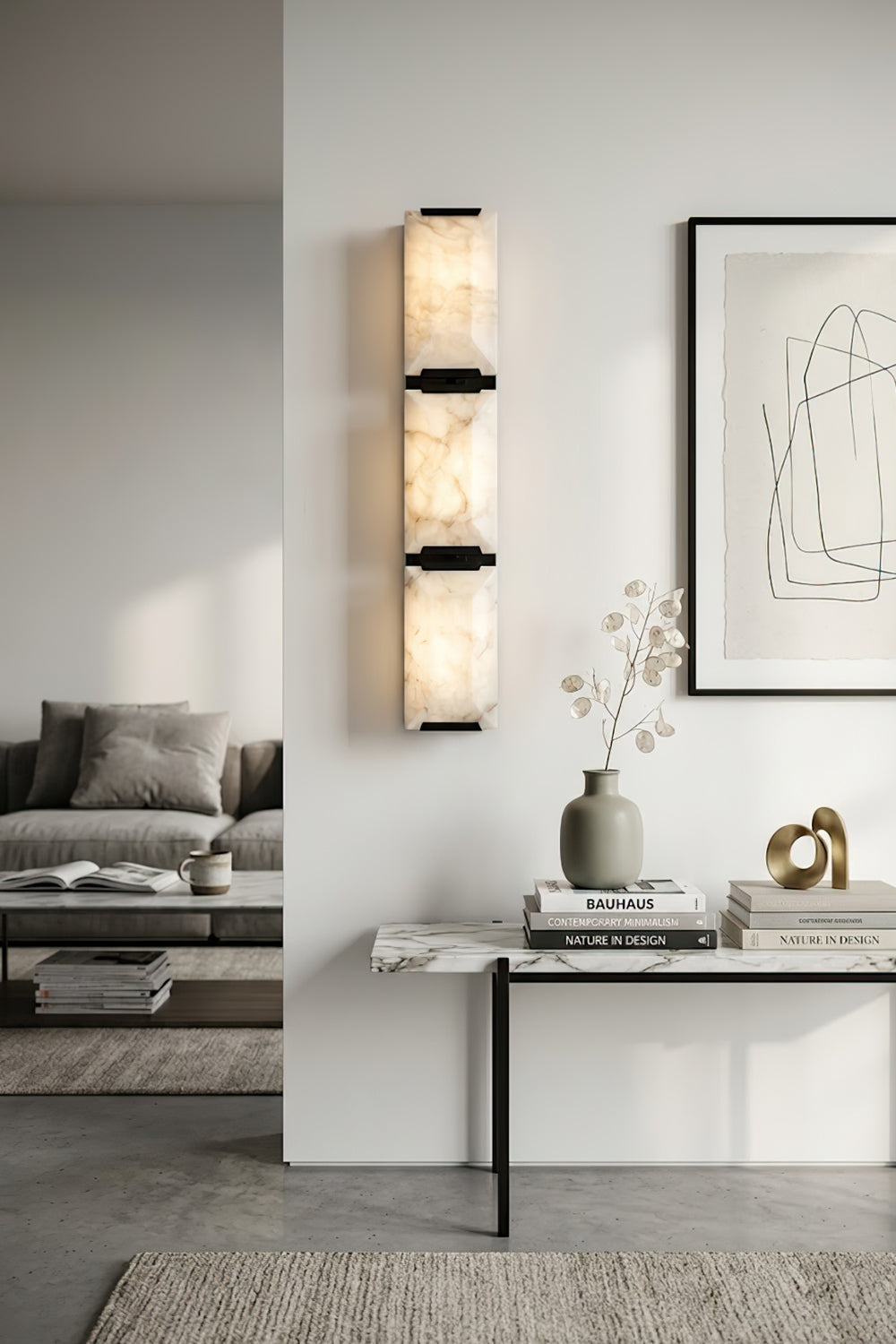Vertical 3-panel alabaster wall lamp | Brass, Alabaster | Installed in a high-ceiling gallery room with a console | vexa lamps