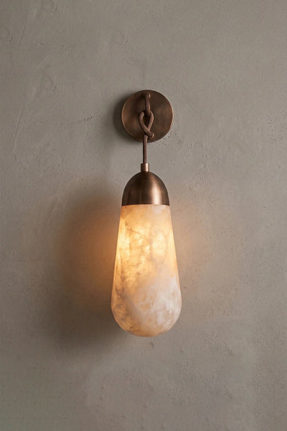 Alabaster Teardrop Wall Sconce featuring a natural alabaster stone and metal backplate, enhancing contemporary decor.