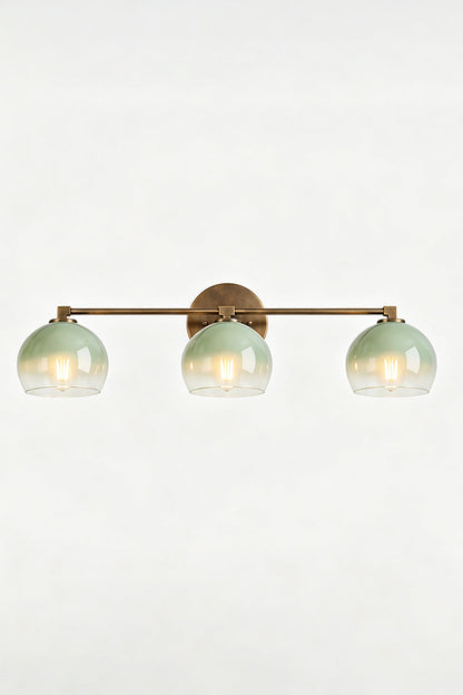 Alba Ombre Glass Wall Sconce with three hand-blown glass globes and a slim iron bar design.
