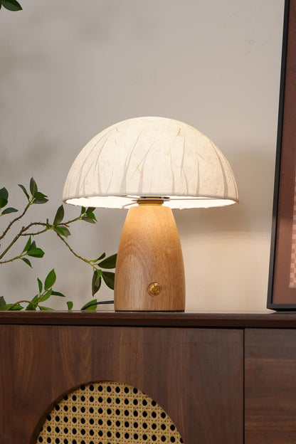 Alice Mushroom Table Lamp | Wood, Glass | Positioned on a dark wood sideboard cabinet with rattan panels, creating a warm mid-century modern vibe | vexa lamps