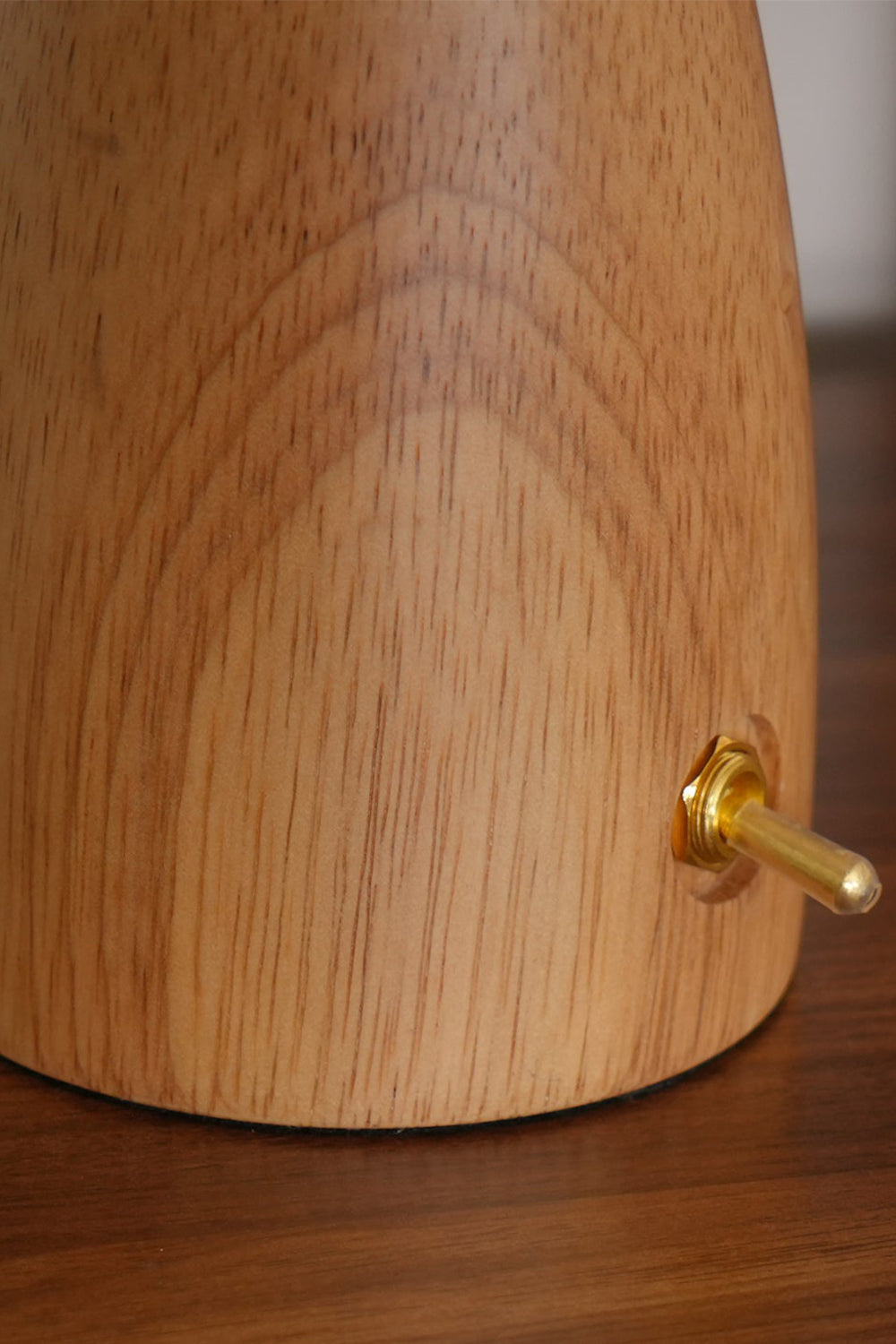 Alice Mushroom Table Lamp | Wood, Glass | Detailed macro shot of the smooth natural oak wood tapered base featuring a small gold metal toggle switch | Detail shot | vexa lamps