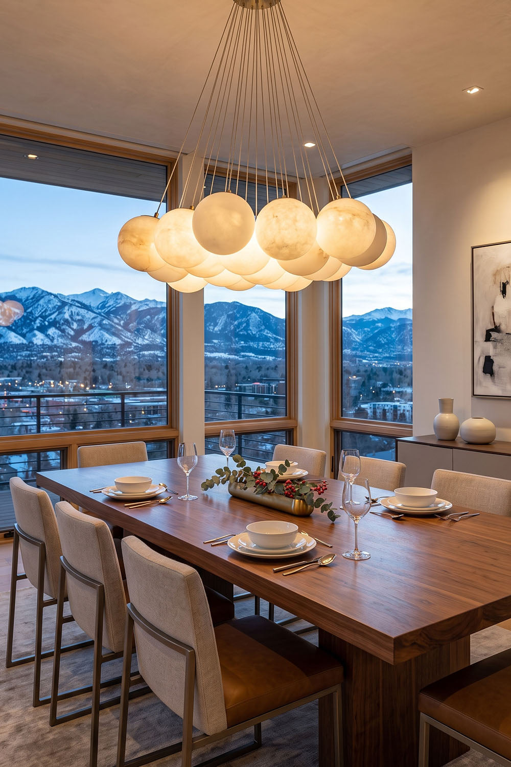 Amandine Alabaster Globe Cluster Pendant Light illuminating a modern dining room with mountain views.