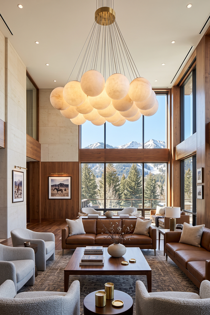 Amandine Alabaster Globe Cluster Pendant Light illuminating a modern living room with mountain views.