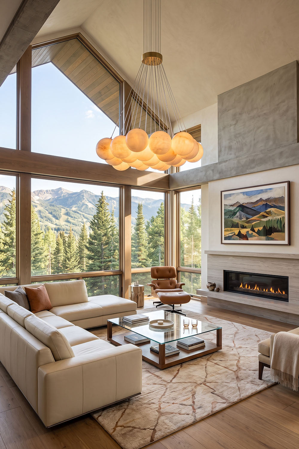 Amandine Alabaster Globe Cluster Pendant Light hanging in a modern living room with large windows and stunning mountain views.