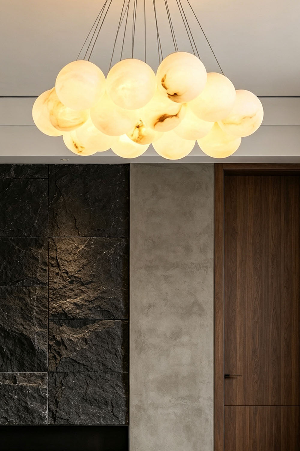 Amandine Alabaster Globe Cluster Pendant Light hanging in a modern dining room, featuring elegant alabaster globe design.