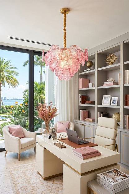 Amara Pink Glass Petal Chandelier | Luxury Home Office | The elegant pink glass variant illuminating a chic contemporary study room next to a soft cream desk and pink chair | vexa lamps
