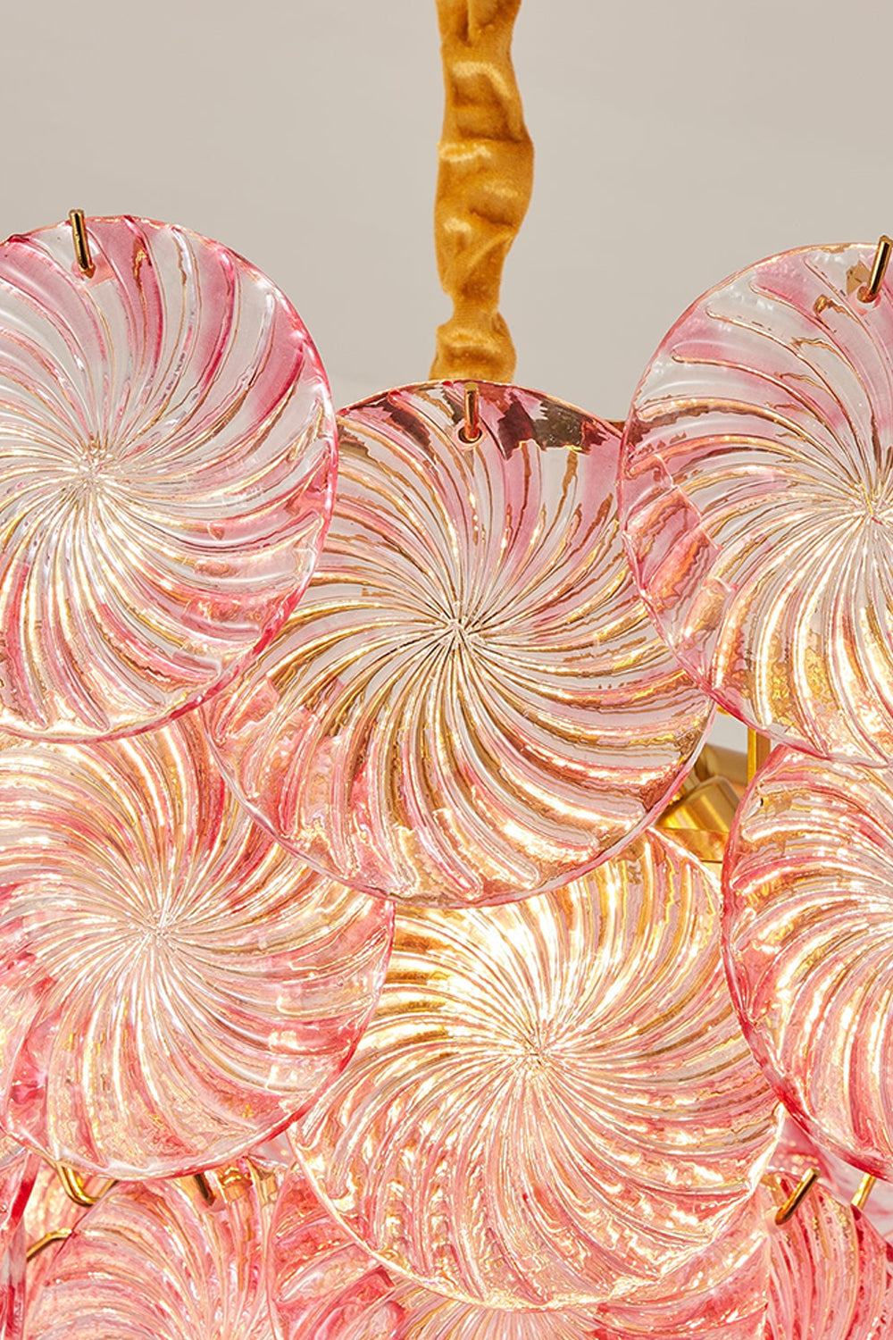 Amara Pink Glass Petal Chandelier | Illuminated Glass | Detailed macro shot of the pink Murano-style glass petals glowing warmly under internal illumination | Detail shot | vexa lamps