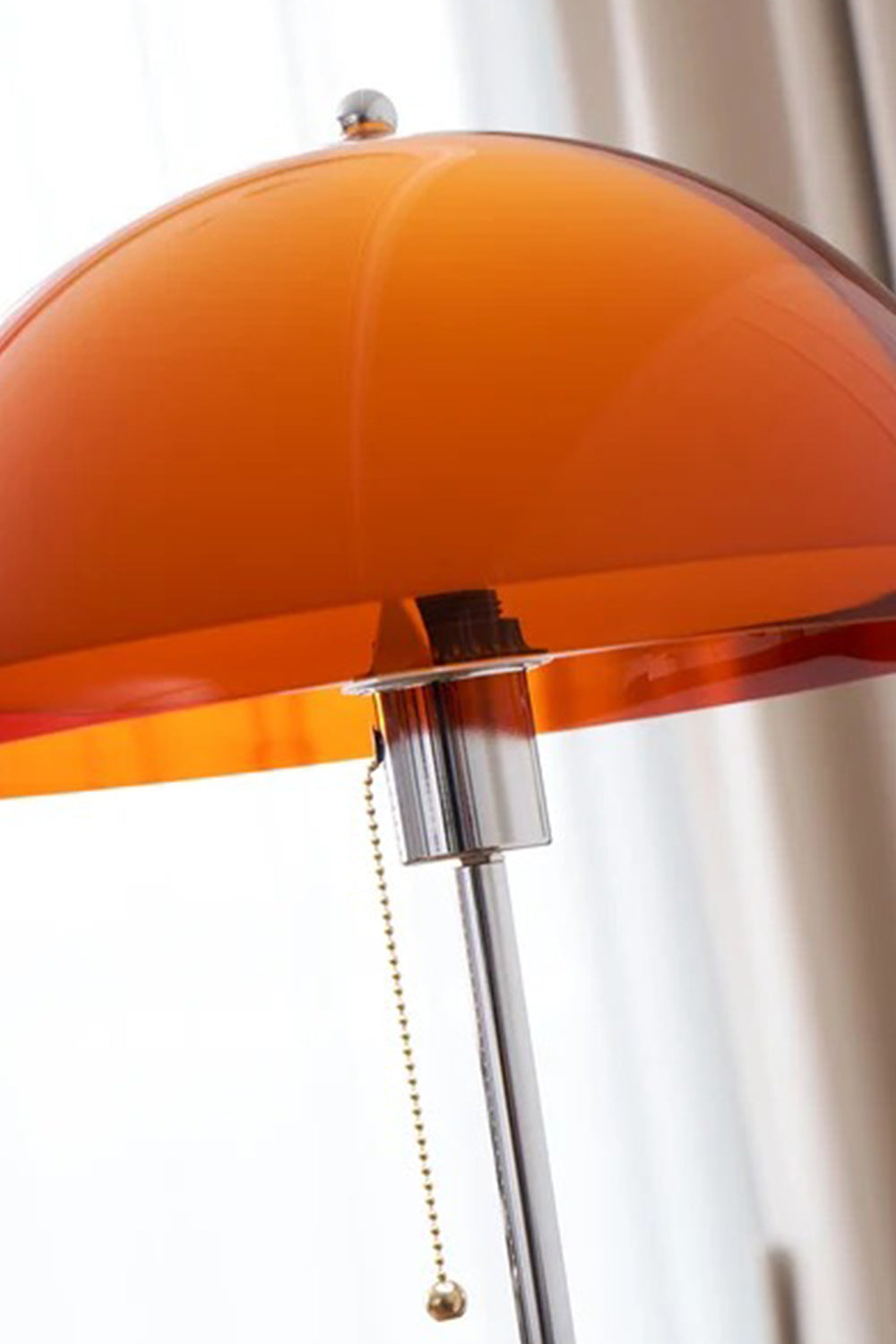 Ambrose Amber Dome Floor Lamp | Amber Glass, Metal and Wood | Close-up view of the illuminated orange-amber shade and pull chain switch | vexa lamps