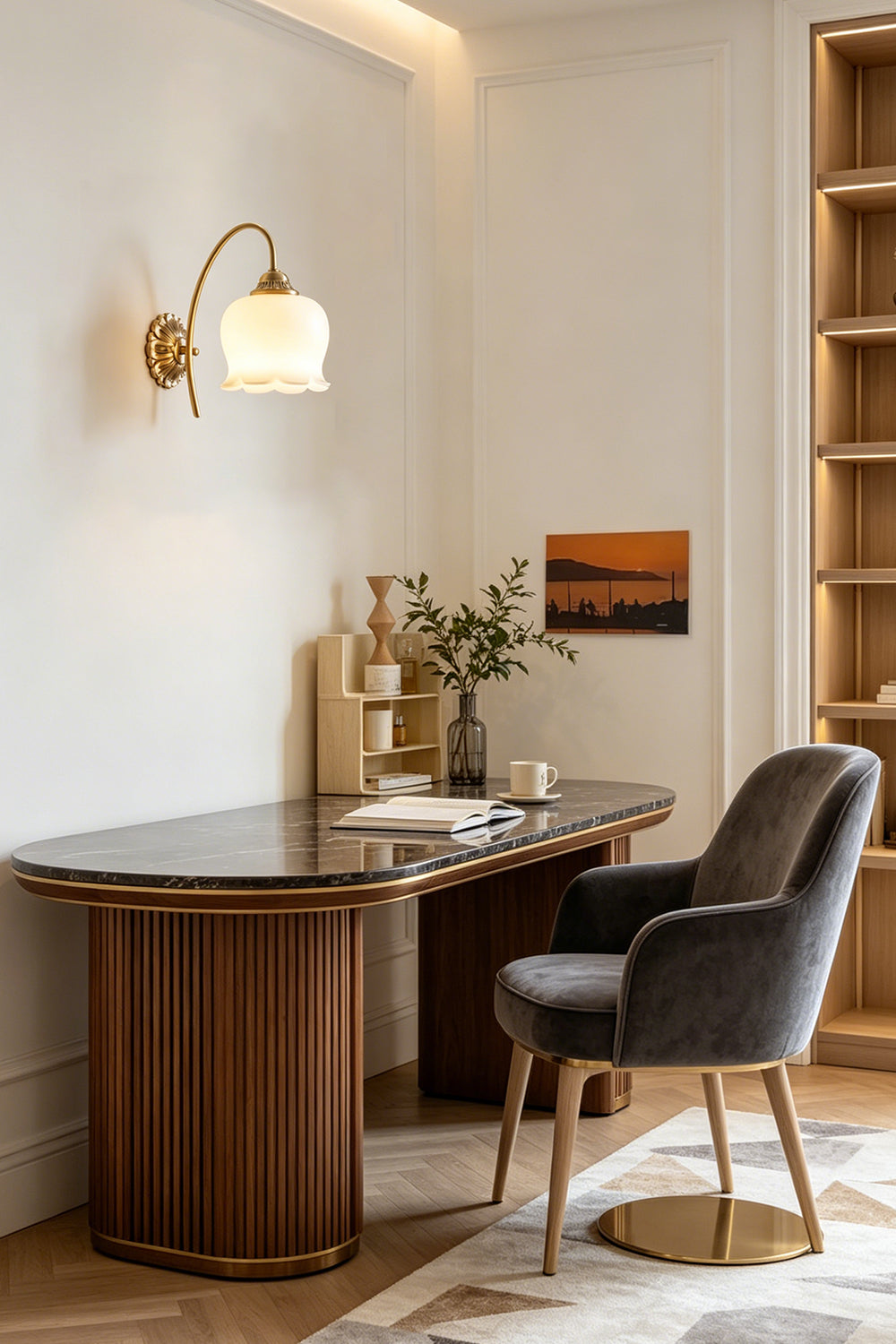 Amelie Vintage Tulip Wall Lamp illuminating a stylish desk setup with a modern chair and decor.