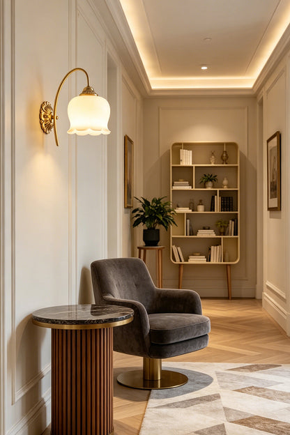 Amelie Vintage Tulip Wall Lamp illuminating a stylish interior with a cozy armchair and elegant decor.