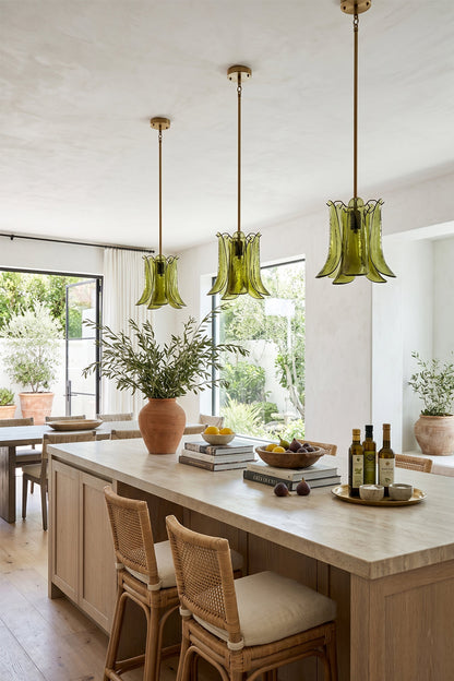 Arboreal Petal Glass Pendant Lamp in a bright kitchen with green pendant lights and wooden decor elements.