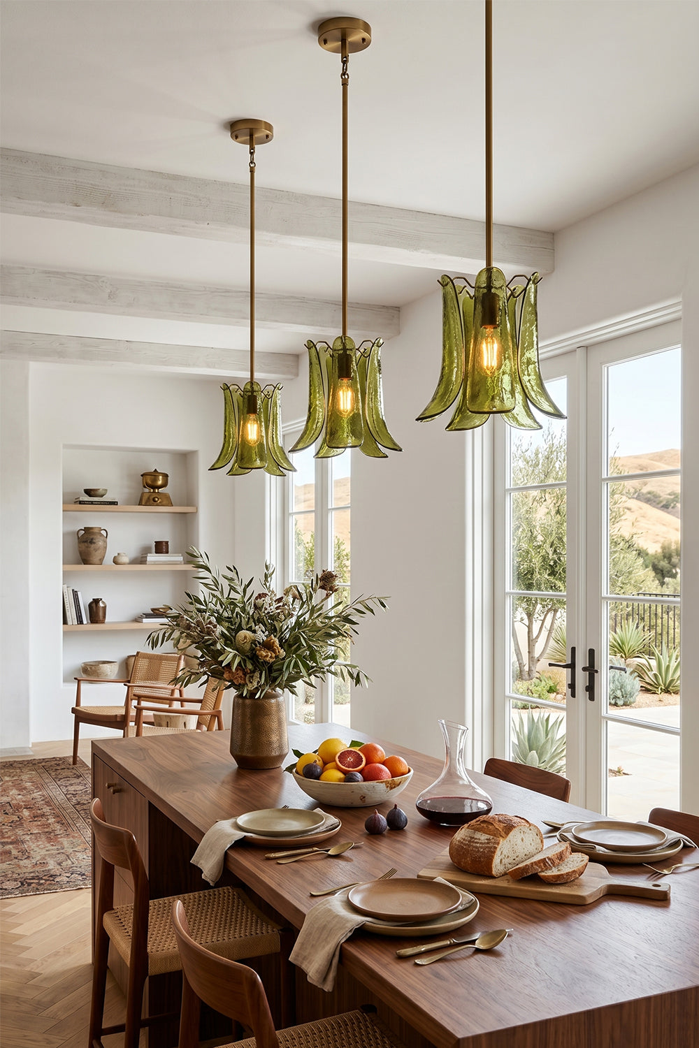 Featuring the Arboreal Petal Glass Pendant Lamp, this dining area showcases elegant green glass lighting above a rustic table.