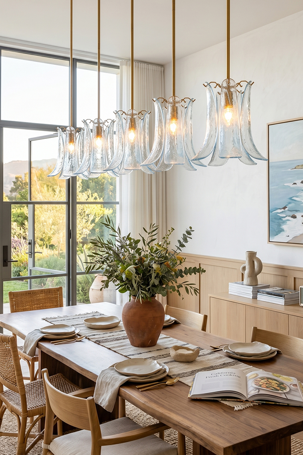 Arboreal Petal Glass Pendant Lamp elegantly illuminates a modern dining space with soft glowing light.