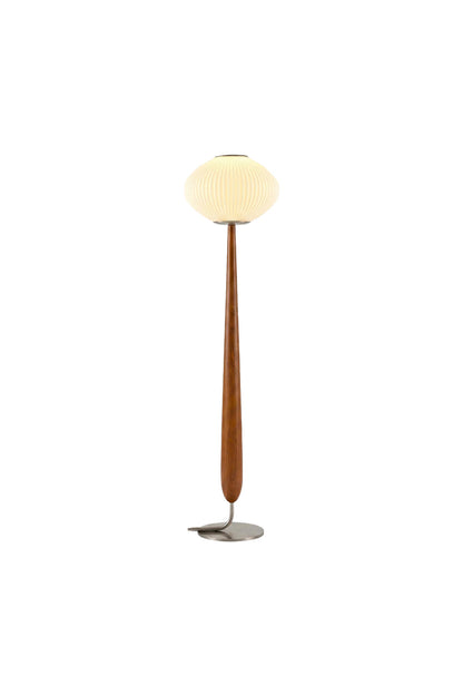 Arden Walnut Floor Lamp | Wood, Metal, Fabric | Isolated lit view of a mid-century modern floor lamp featuring a pleated white pumpkin saucer shade on a tapered teardrop-shaped natural walnut wood stem and a circular brushed silver base | White background | vexa lamps