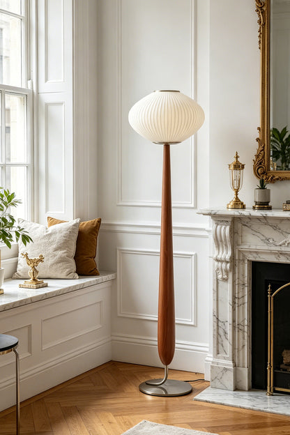 Arden Walnut Floor Lamp | Wood, Metal, Fabric | Positioned beautifully in a traditional living room corner featuring white windows, a classic mantle piece, and herringbone hardwood floors | vexa lamps