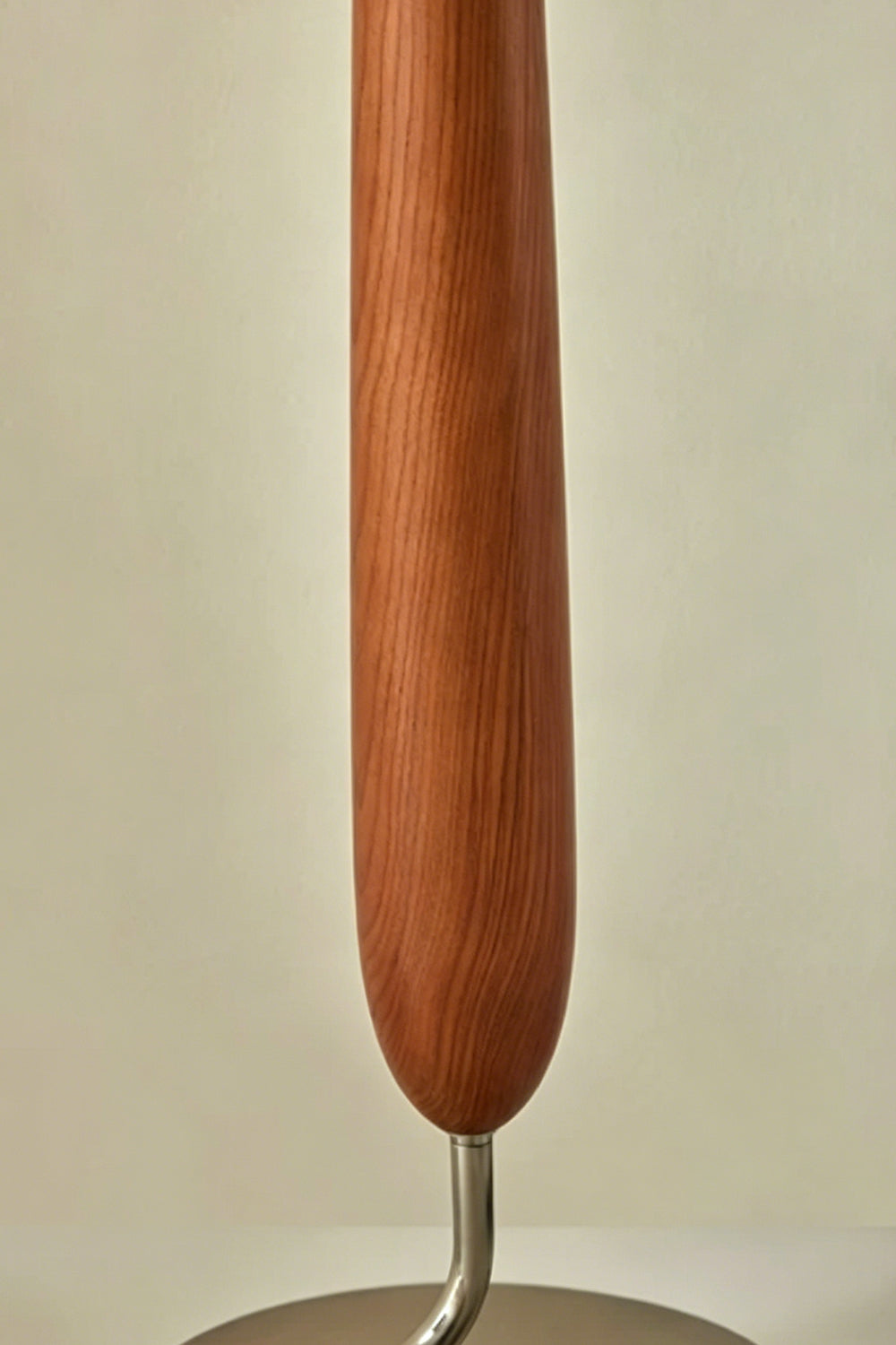 Arden Walnut Floor Lamp | Wood, Metal, Fabric | Detailed close-up focus on the sculpted teardrop-shaped central body highlighting the natural rich brown walnut wood grain texture | Detail shot | vexa lamps