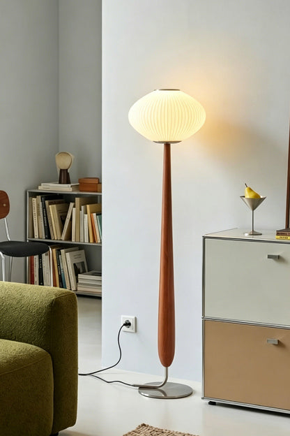 Arden Walnut Floor Lamp | Wood, Metal, Fabric | Casting a welcoming golden glow in a contemporary residential living space corner next to a modern credenza cabinet | vexa lamps