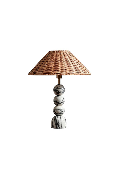 Aria Rattan & Stacked Marble Table Lamp featuring a woven rattan shade and a stacked marble base with charcoal veining.