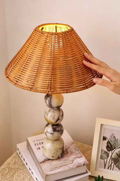 Aria Rattan & Stacked Marble Table Lamp featuring a woven rattan shade and stacked marble base.