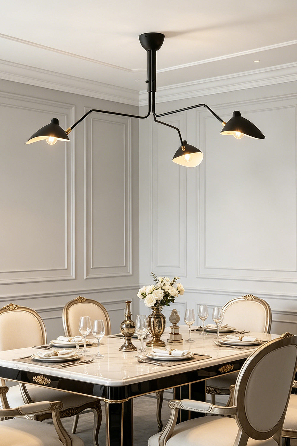 Black 3-arm articulated multi arm spider light | Metal | Installed in a formal dining room with upholstered chairs | vexa lamps