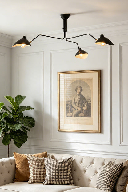 Black 3-arm articulated spider ceiling light | Metal | Living room scene mounted near a large picture frame | vexa lamps