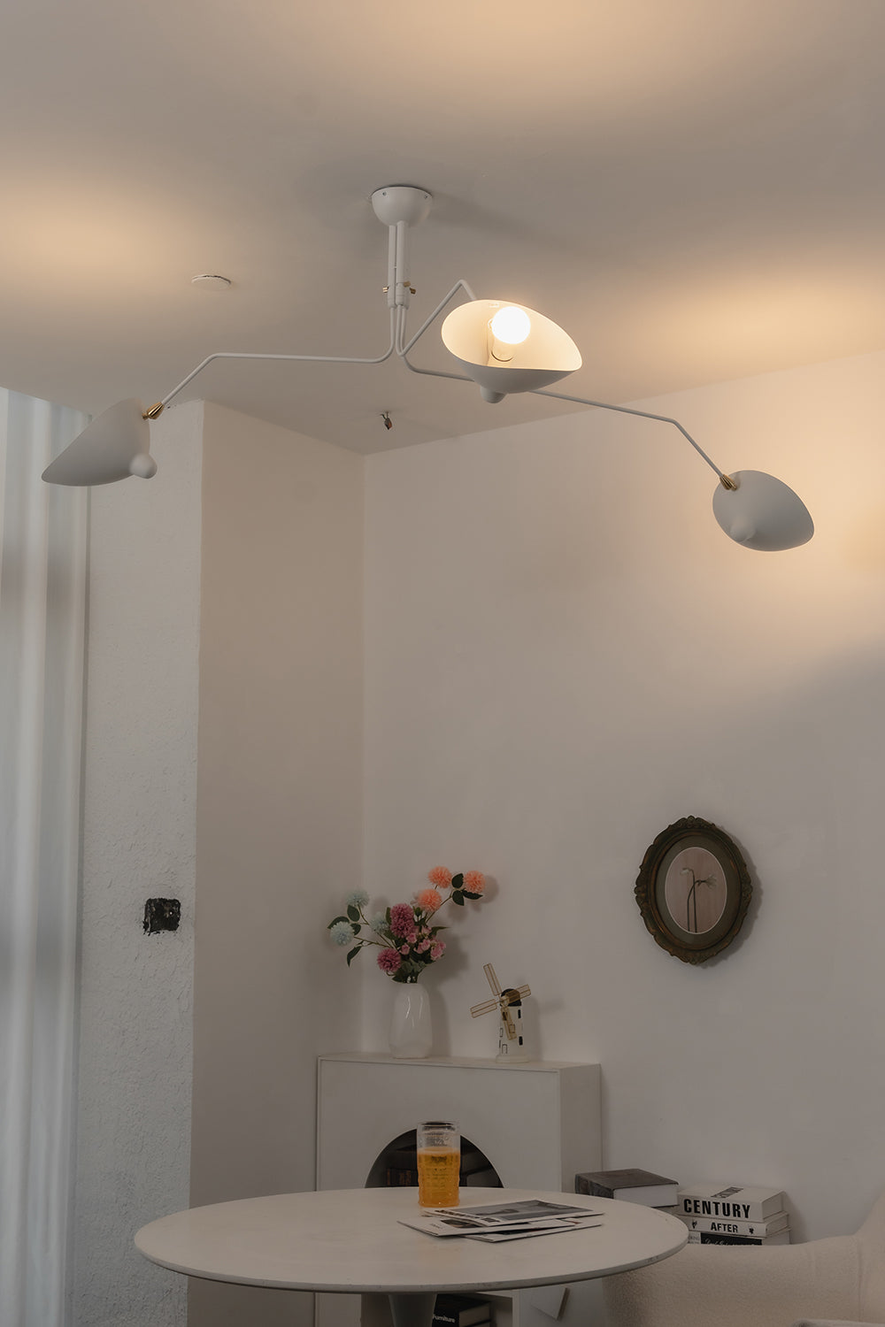 White 3-arm multi arm spider ceiling light | Metal | Modern cafe interior scene with minimalist decor | vexa lamps