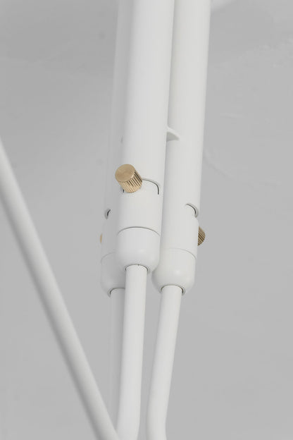 Brass pivot joint detail on white spider light | Metal | Functional detail shot of the articulated arm mechanism | vexa lamps