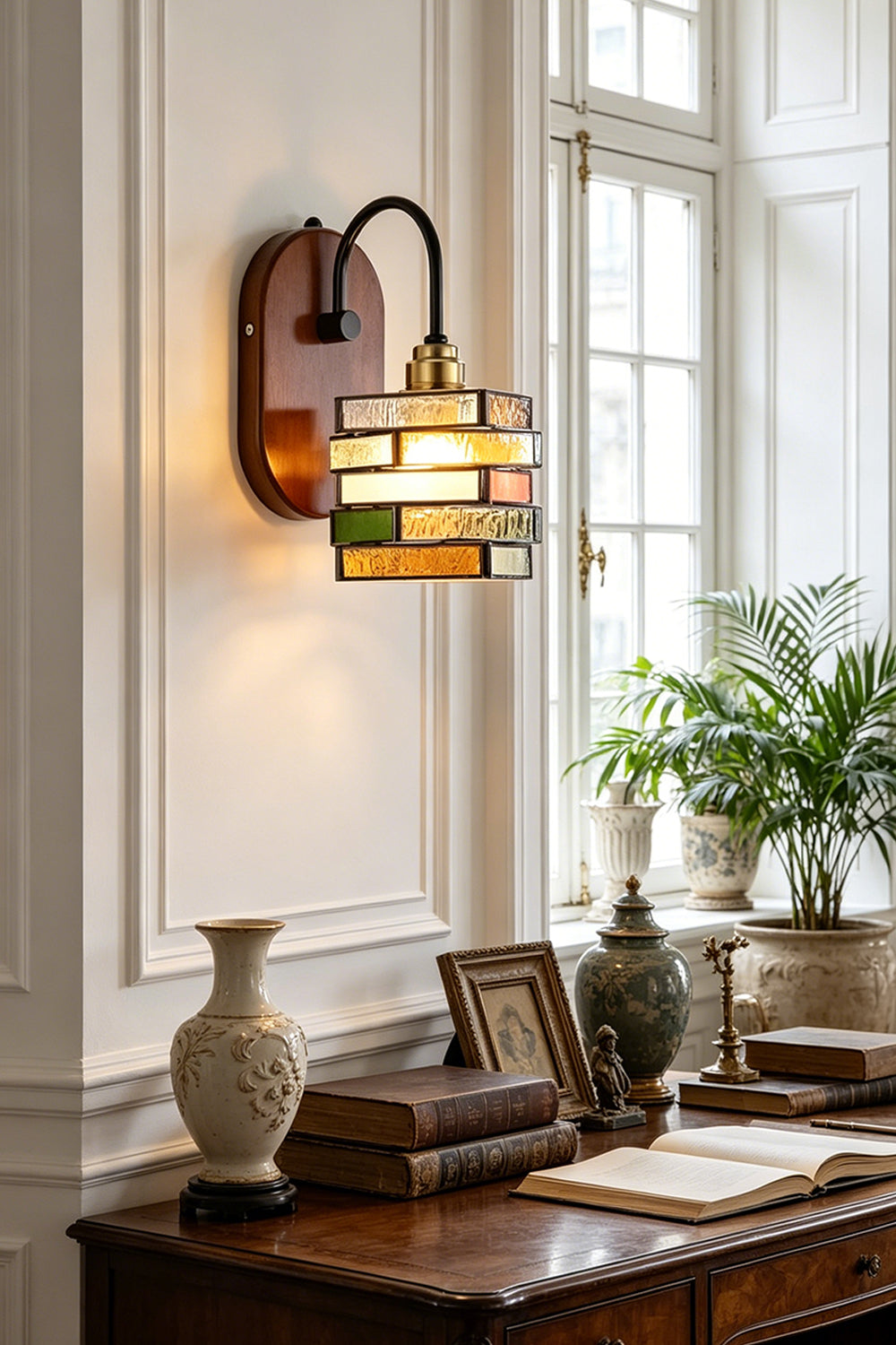 Artisan Mosaic Stained Glass Wall Sconce illuminating a stylish interior with decorative accents.
