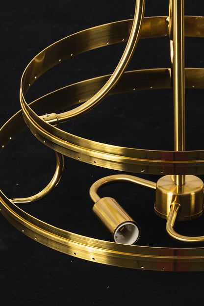 Aura Verdant Tiered Green Glass Ceiling Light | Metal, Glass | Detailed view of the unlit gold frame ring and internal bulb sockets against a dark background | Detail shot | vexa lamps