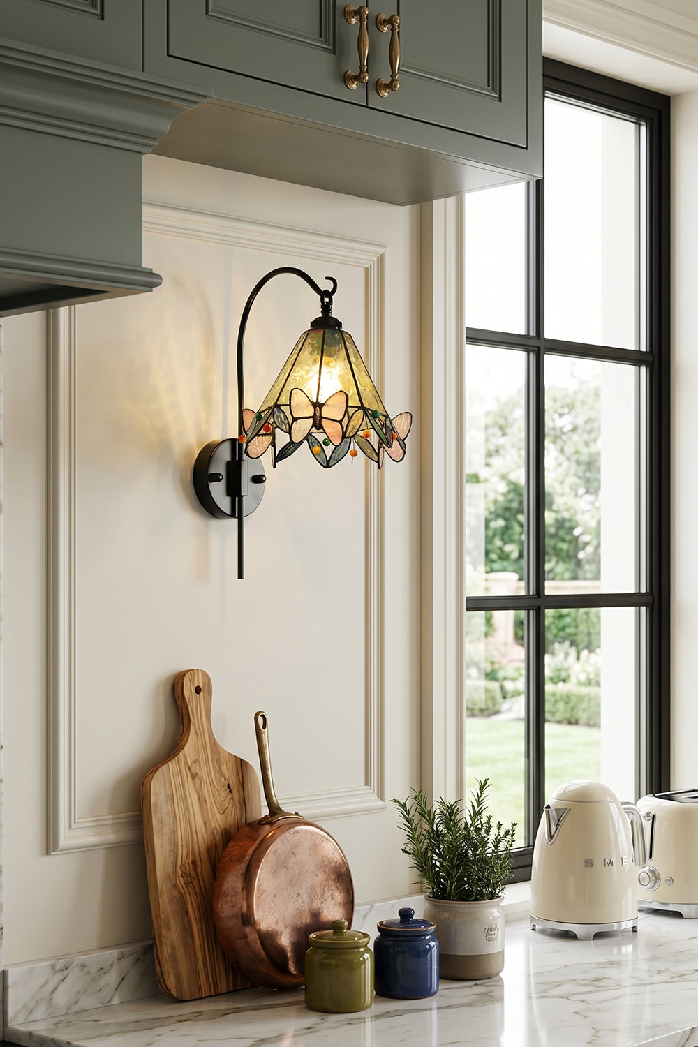 Aura Vine Stained Glass Wall Sconce | Glass, Metal | Mounted on a white wall in a cozy farmhouse kitchen next to a window over a countertop with rustic accessories | vexa lamps