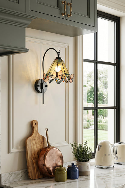 Aura Vine Stained Glass Wall Sconce | Glass, Metal | Mounted on a white wall in a cozy farmhouse kitchen next to a window over a countertop with rustic accessories | vexa lamps