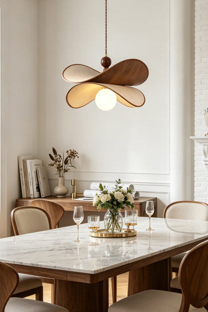 Aurelia Blossom Glass Pendant Light | Wood, Fabric, Glass | Providing warm ambient downlight over a contemporary white marble dining table paired with minimalist wooden chairs | vexa lamps
