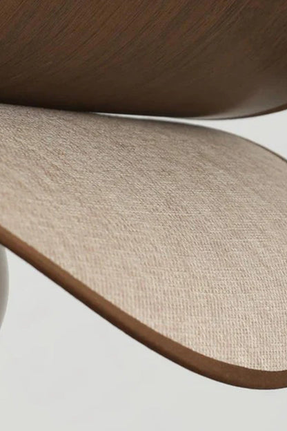 vAurelia Blossom Glass Pendant Light | Wood, Fabric, Glass | Macro close-up focus on the curved edge texture highlighting the contrast between smooth walnut wood veneer and woven linen fabric layers | Detail shot | vexa lamps