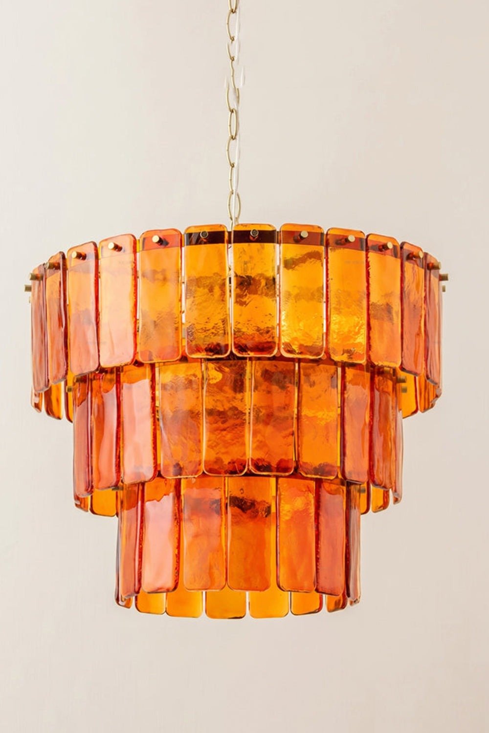Aurelia Tiered Amber Glass Chandelier featuring cascading amber glass panels for a warm, stylish illumination.