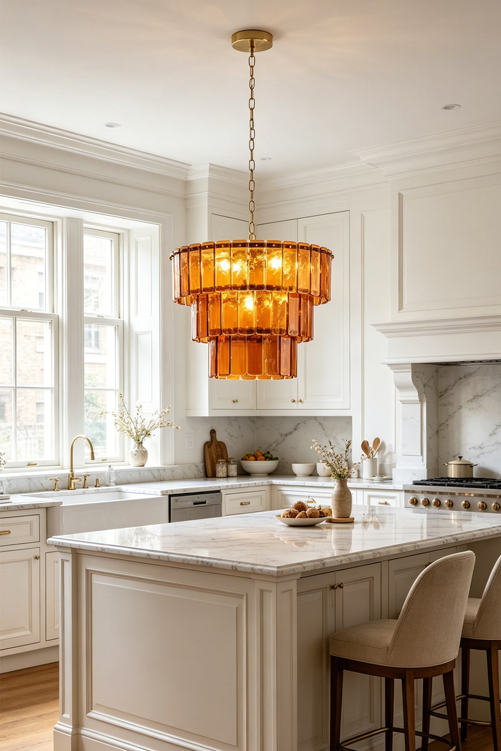 Aurelia Tiered Amber Glass Chandelier illuminating a modern kitchen with honey-toned glass panels.