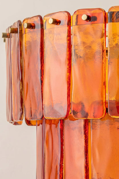 Close-up of Aurelia Tiered Amber Glass Chandelier showcasing textured honey-toned glass panels.