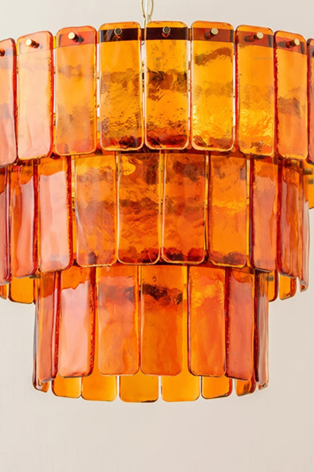 Aurelia Tiered Amber Glass Chandelier showcasing rich amber glass panels in a tiered design.
