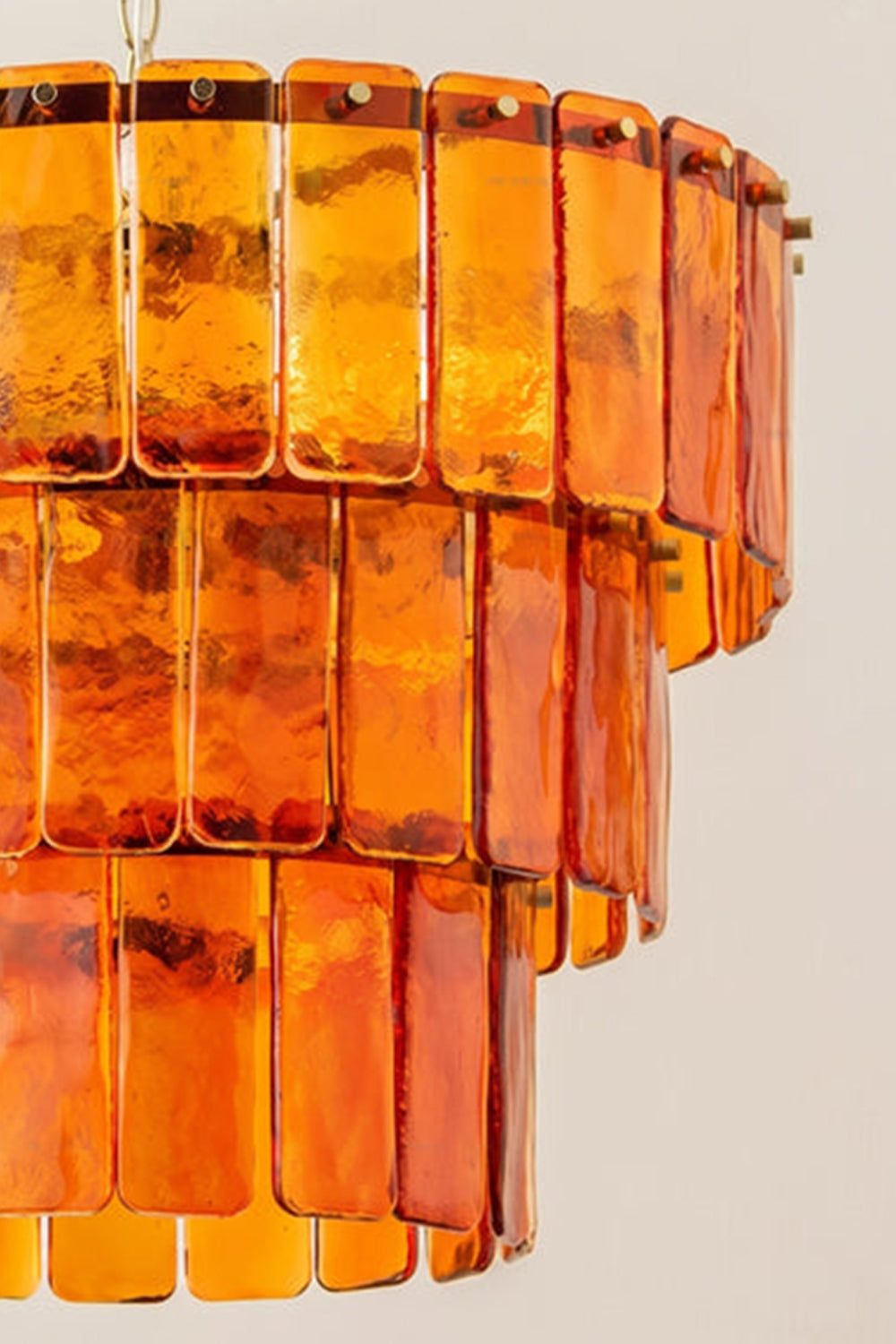 Aurelia Tiered Amber Glass Chandelier showcasing vibrant amber glass panels in a tiered design.