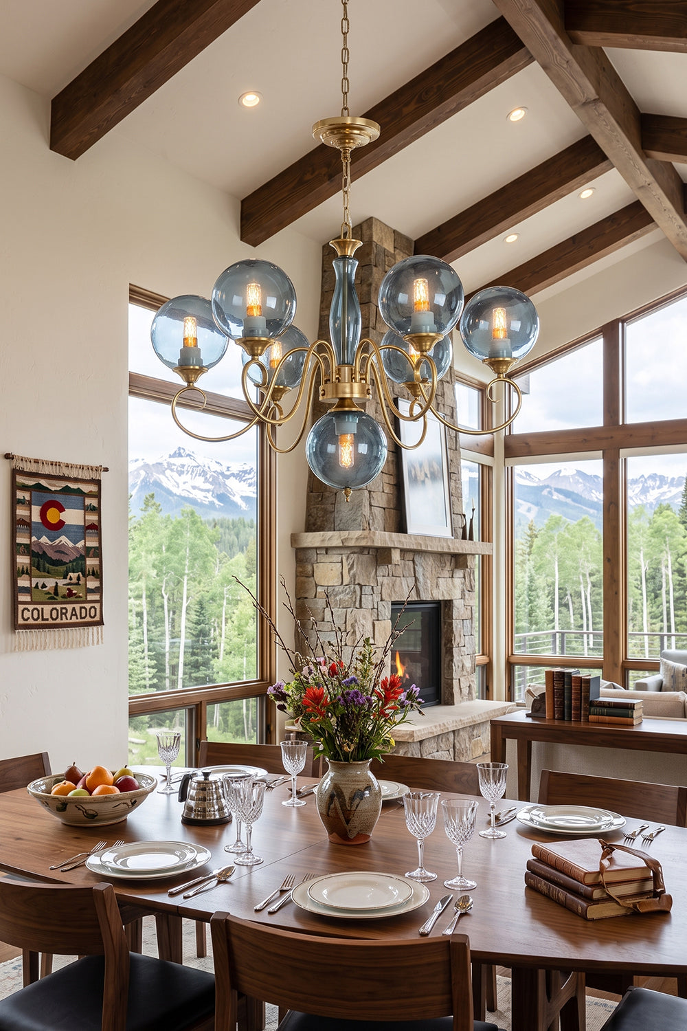 Aveline Globe Cluster Chandelier | Colored Glass and Brass | Blue glass version in a high-ceiling dining room with scenic mountain views | vexa lamps