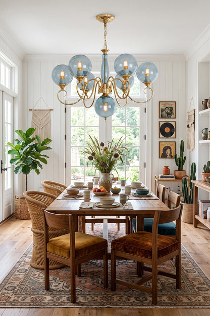 Aveline Globe Cluster Chandelier | Colored Glass and Brass | Blue glass shade version hanging above a wooden dining table | vexa lamps