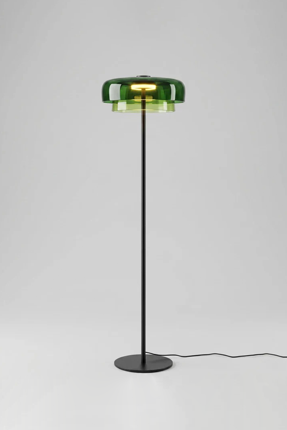 Aven Minimalist Architectural Floor Lamp | Glass, Metal | Studio product view of the fully lit green glass variant casting a crisp botanical glow against a plain white background | vexa lamps